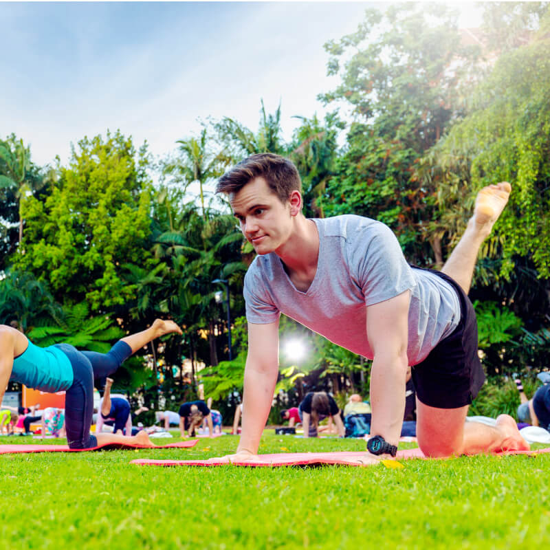 Man doing yoga at South Bank Parklands